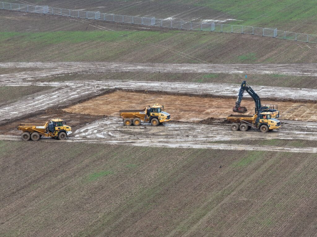 Excavators work in the Core Zone archaeology works February 2026